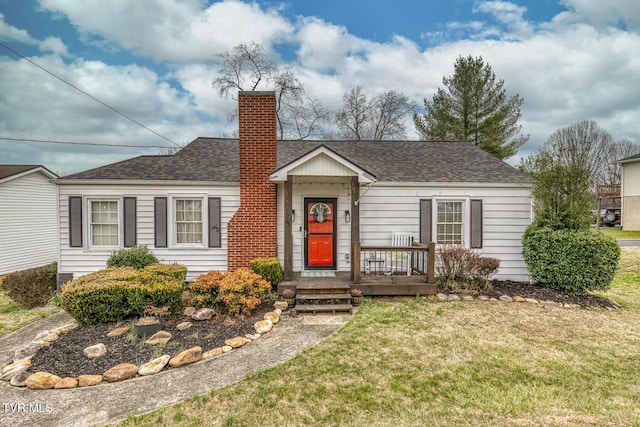 single story home featuring a front lawn, roof with shingles, and a chimney