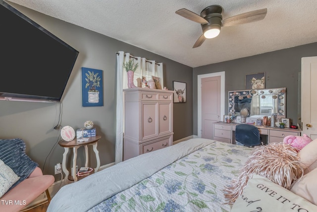 bedroom featuring a textured ceiling and ceiling fan