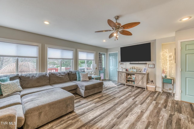 living area featuring recessed lighting, baseboards, ceiling fan, and wood finished floors