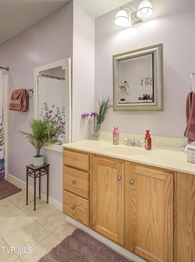 full bath featuring tile patterned flooring and vanity