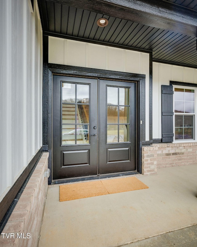 property entrance with brick siding