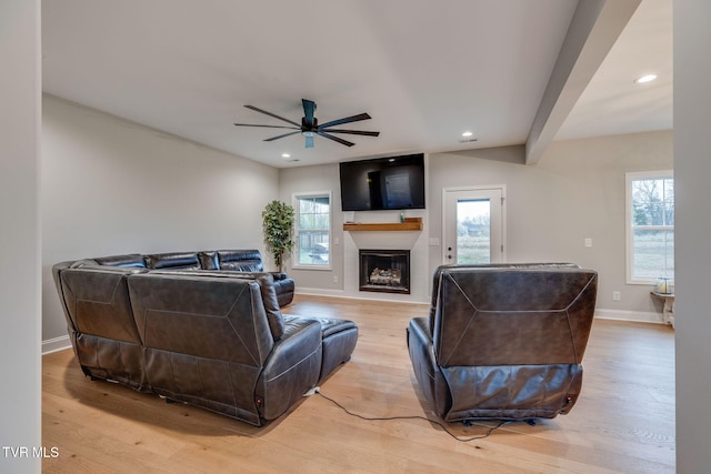 living area with recessed lighting, a fireplace, light wood finished floors, baseboards, and ceiling fan