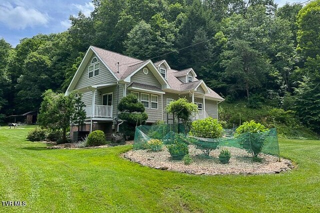 view of property exterior with a lawn