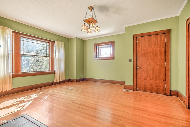 415 Fairgrounds Rd, Greeneville, TN 37745 - empty room featuring visible vents, baseboards, crown molding, and light wood finished floors