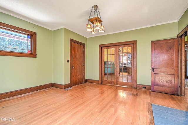 415 Fairgrounds Rd, Greeneville, TN 37745 - empty room featuring wood finished floors, crown molding, french doors, and baseboards