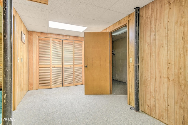 415 Fairgrounds Rd, Greeneville, TN 37745 - interior space with a closet, a drop ceiling, wood walls, and carpet floors