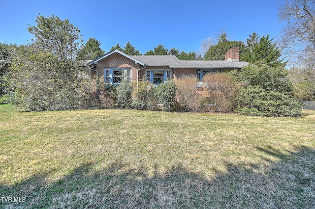 415 Fairgrounds Rd, Greeneville, TN 37745 - view of property exterior with a yard, brick siding, and a chimney