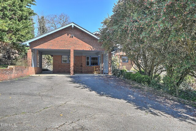 415 Fairgrounds Rd, Greeneville, TN 37745 - view of front of home featuring aphalt driveway, a carport, and brick siding
