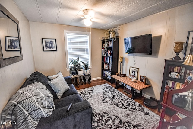 living room featuring ceiling fan and wood finished floors