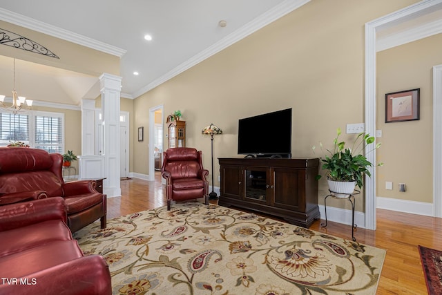 20324 Josh Allen Dr, Abingdon, VA 24211 - living area with baseboards, ornamental molding, an inviting chandelier, wood finished floors, and ornate columns