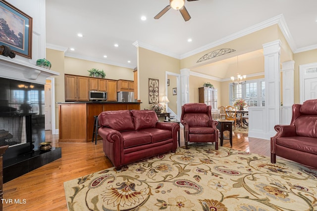 20324 Josh Allen Dr, Abingdon, VA 24211 - living room with decorative columns, recessed lighting, crown molding, ceiling fan with notable chandelier, and light wood-type flooring