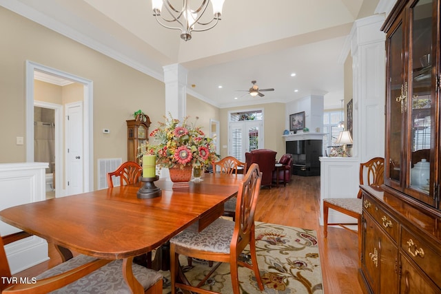 20324 Josh Allen Dr, Abingdon, VA 24211 - dining room featuring visible vents, ornate columns, light wood finished floors, ornamental molding, and ceiling fan with notable chandelier