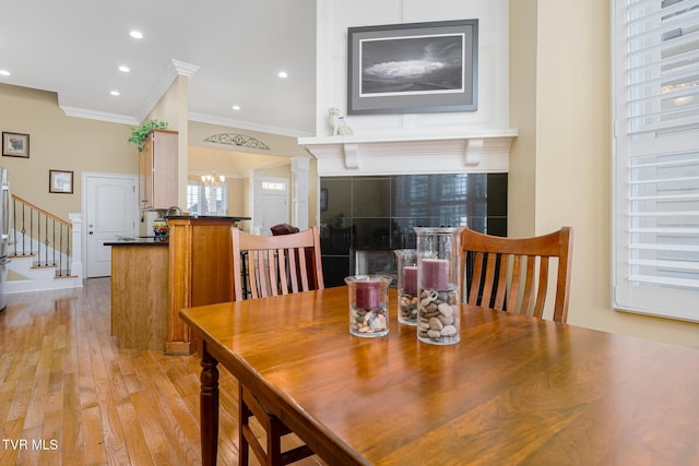 20324 Josh Allen Dr, Abingdon, VA 24211 - dining room with crown molding, a chandelier, stairway, light wood-style flooring, and recessed lighting
