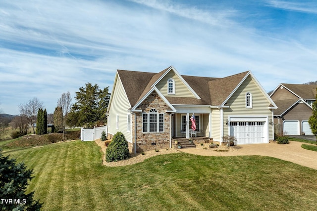 20324 Josh Allen Dr, Abingdon, VA 24211 - view of front of house featuring a front lawn, a garage, stone siding, driveway, and a gate