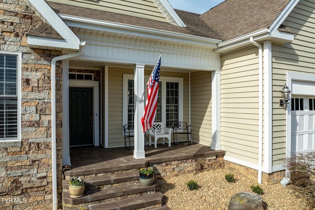 20324 Josh Allen Dr, Abingdon, VA 24211 - doorway to property featuring stone siding, a porch, an attached garage, and roof with shingles
