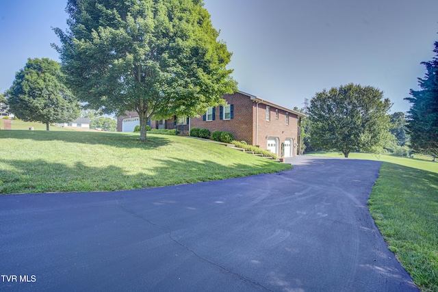 142 Laurel Acres Ct, Jonesborough, TN 37659 - view of front of house with an attached garage, asphalt driveway, a front yard, and brick siding