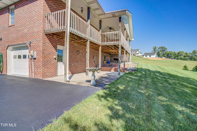 142 Laurel Acres Ct, Jonesborough, TN 37659 - view of home's exterior with a garage, a lawn, ceiling fan, a deck, and brick siding