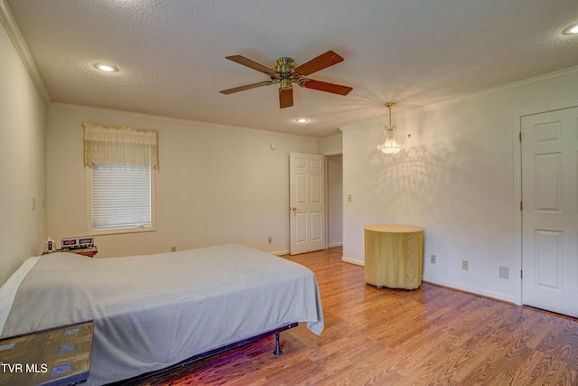 142 Laurel Acres Ct, Jonesborough, TN 37659 - bedroom with wood finished floors, crown molding, recessed lighting, and a textured ceiling