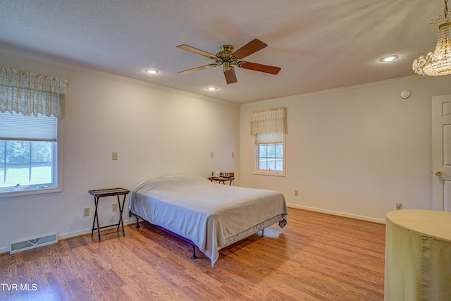 142 Laurel Acres Ct, Jonesborough, TN 37659 - bedroom with ornamental molding, multiple windows, recessed lighting, wood finished floors, and a chandelier