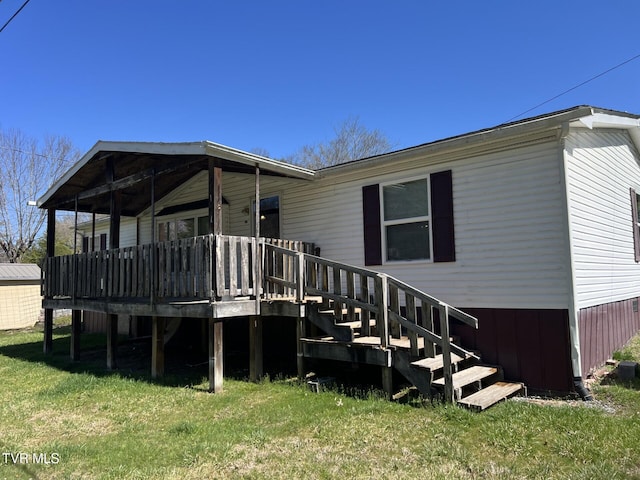 157 Power House Holw, Clintwood, VA 24228 - back of property featuring a lawn, stairs, and a deck