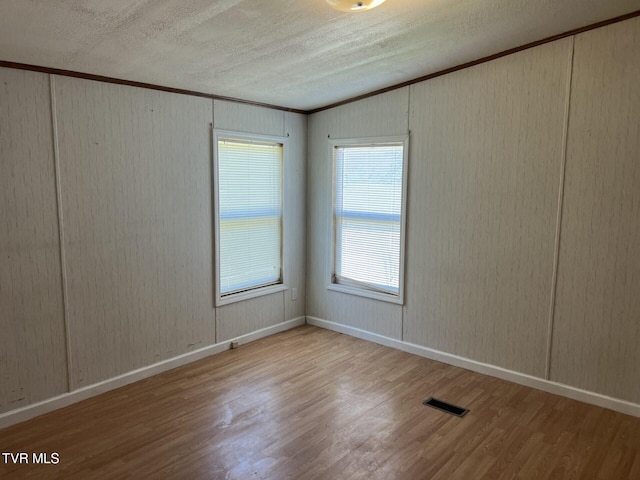 157 Power House Holw, Clintwood, VA 24228 - spare room featuring visible vents, baseboards, a textured ceiling, and wood finished floors