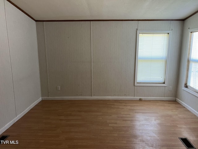 157 Power House Holw, Clintwood, VA 24228 - spare room featuring visible vents, crown molding, baseboards, and wood finished floors