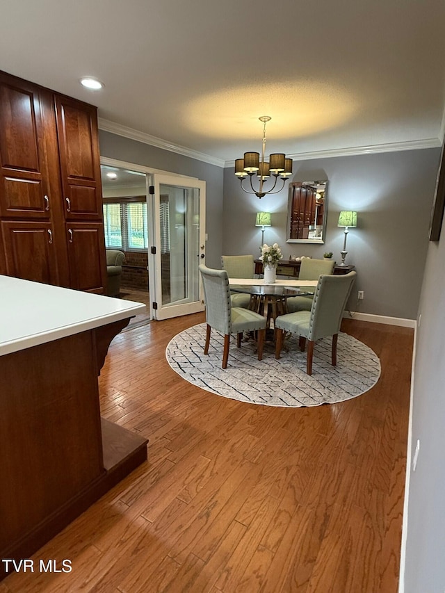 1209 Beechwood Dr, Johnson City, TN 37604 - dining area with crown molding, a chandelier, wood finished floors, and baseboards