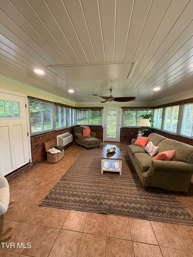 1209 Beechwood Dr, Johnson City, TN 37604 - living room featuring tile patterned flooring, an AC wall unit, and crown molding