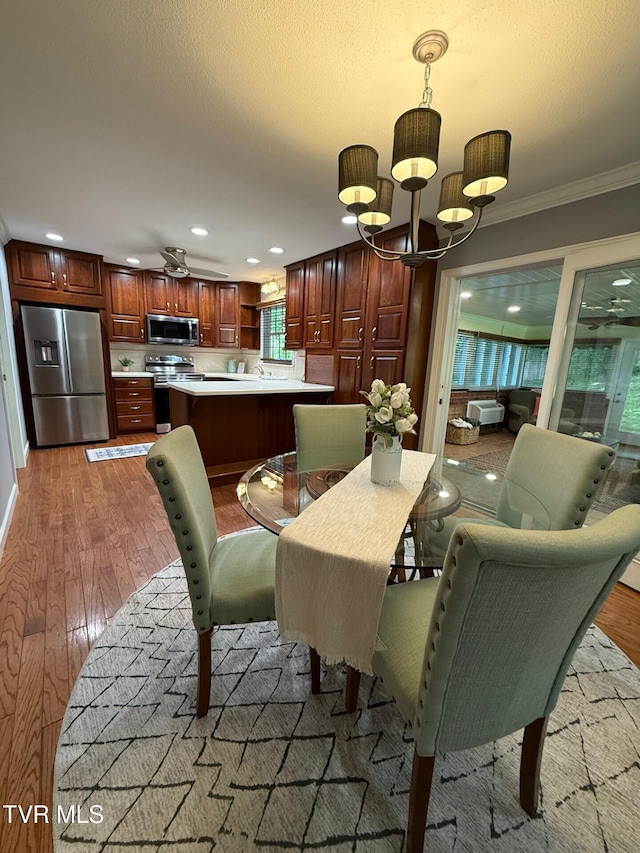 1209 Beechwood Dr, Johnson City, TN 37604 - dining space featuring ornamental molding, wood finished floors, a chandelier, and recessed lighting