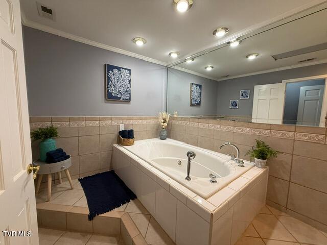 1209 Beechwood Dr, Johnson City, TN 37604 - full bath featuring crown molding, tile patterned flooring, a garden tub, and tile walls