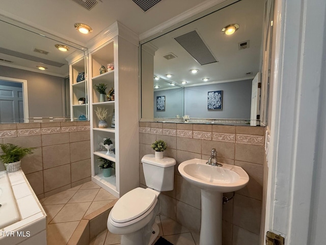 1209 Beechwood Dr, Johnson City, TN 37604 - bathroom with tile walls, toilet, ornamental molding, and tile patterned flooring