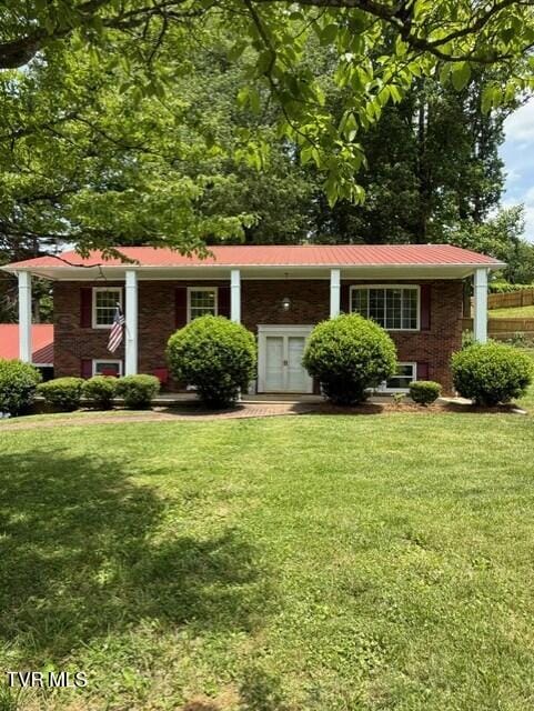 1209 Beechwood Dr, Johnson City, TN 37604 - split foyer home with a front lawn, brick siding, and metal roof