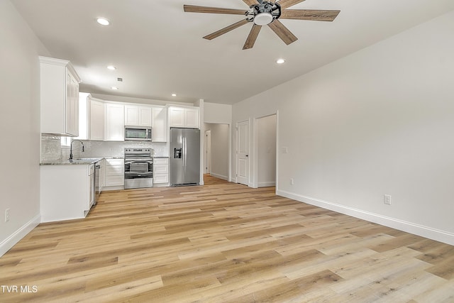703 Swadley Rd, Johnson City, TN 37601 - kitchen featuring appliances with stainless steel finishes, ceiling fan, a sink, tasteful backsplash, and recessed lighting