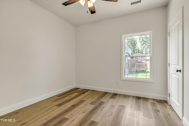 703 Swadley Rd, Johnson City, TN 37601 - unfurnished room with light wood finished floors, a ceiling fan, and baseboards