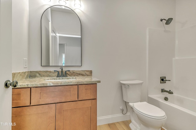 703 Swadley Rd, Johnson City, TN 37601 - full bath with toilet, baseboards, wood finished floors, vanity, and tub / shower combination