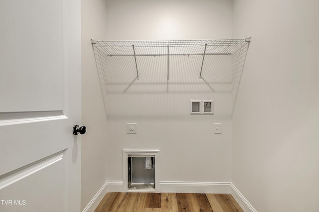 703 Swadley Rd, Johnson City, TN 37601 - washroom with hookup for an electric dryer, washer hookup, wood finished floors, and baseboards