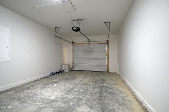 703 Swadley Rd, Johnson City, TN 37601 - garage with a garage door opener and baseboards