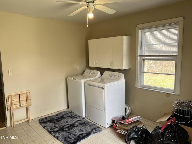 washroom with a ceiling fan, cabinet space, and washing machine and dryer