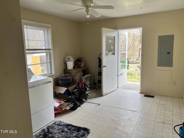 entryway featuring a ceiling fan, visible vents, washing machine and dryer, and electric panel