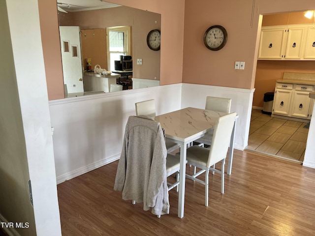 dining space featuring wood finished floors