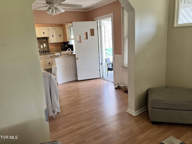 interior space with baseboards and light wood-type flooring