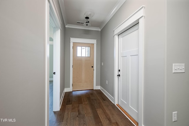 entryway featuring ornamental molding, dark wood-type flooring, and baseboards