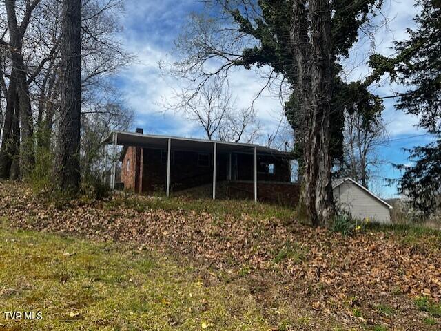 exterior space with a carport