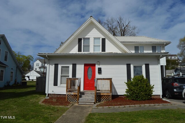 bungalow-style house featuring a front yard