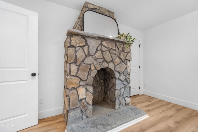 112 W Chestnut St, Johnson City, TN 37604 - room details with a fireplace, wood finished floors, and baseboards