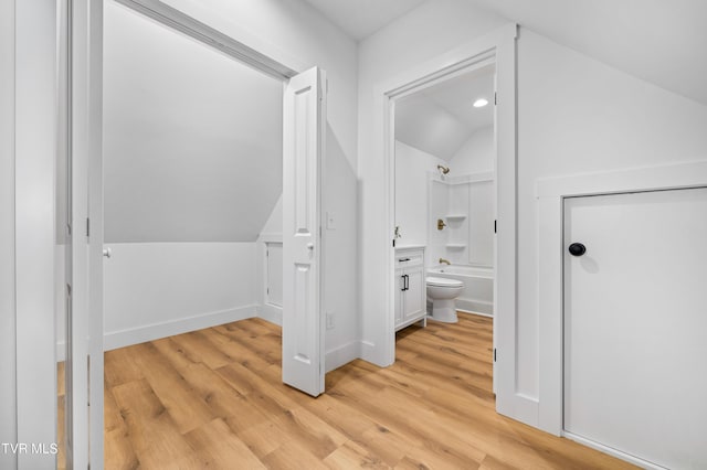 112 W Chestnut St, Johnson City, TN 37604 - bathroom featuring vanity, shower / washtub combination, vaulted ceiling, and wood finished floors