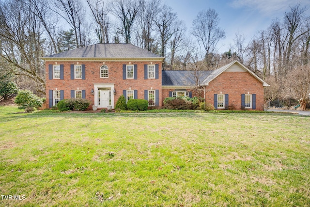 1221 Radcliffe Ave, Kingsport, TN 37664 - colonial-style house featuring a front yard and brick siding