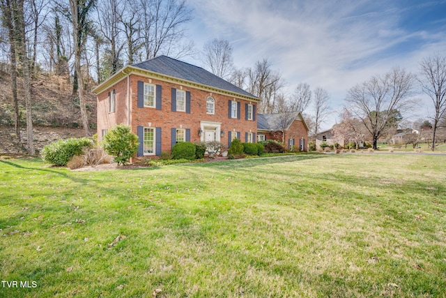 1221 Radcliffe Ave, Kingsport, TN 37664 - georgian-style home with brick siding and a front lawn