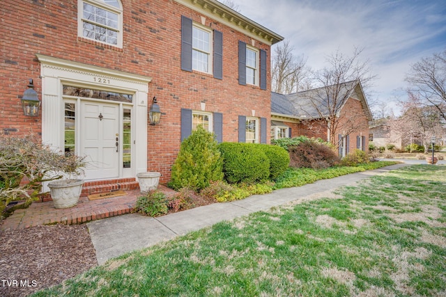 1221 Radcliffe Ave, Kingsport, TN 37664 - view of front of property with brick siding and a front yard