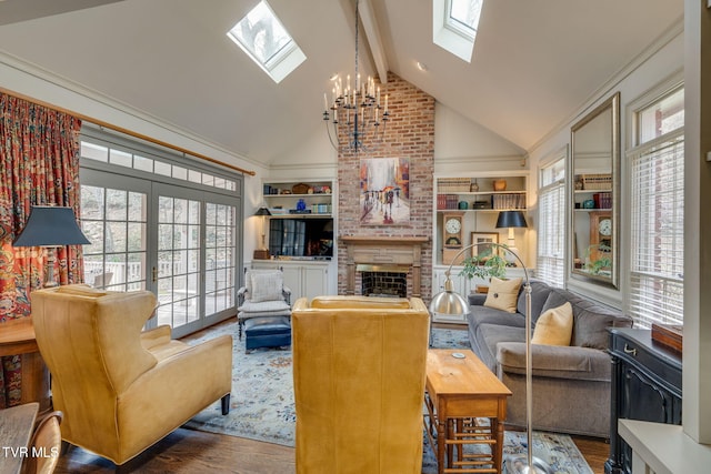 1221 Radcliffe Ave, Kingsport, TN 37664 - living room with a notable chandelier, wood finished floors, a skylight, a brick fireplace, and beamed ceiling